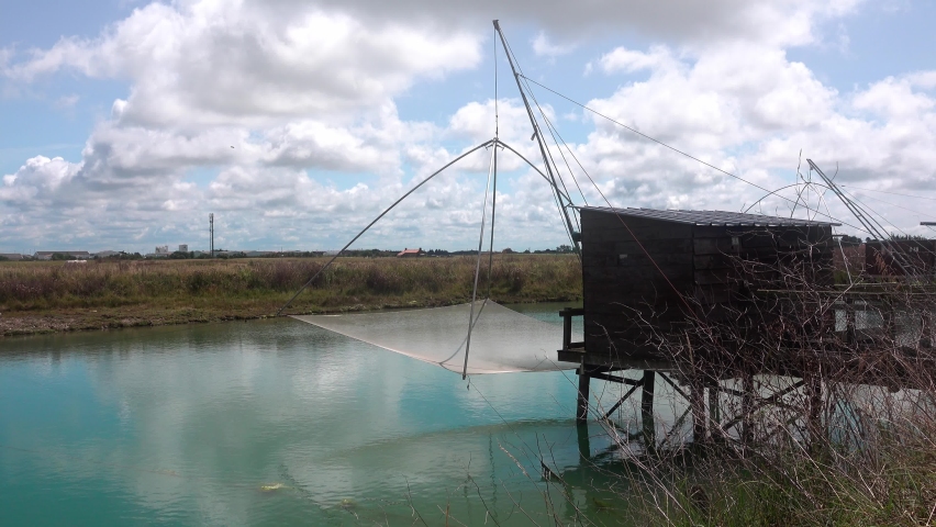Traditional French fishing huts on the canal of Atlantic coast . Vendee, France..