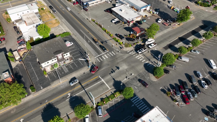 Orbiting aerial shot of an urban intersection in Anacortes, WA.