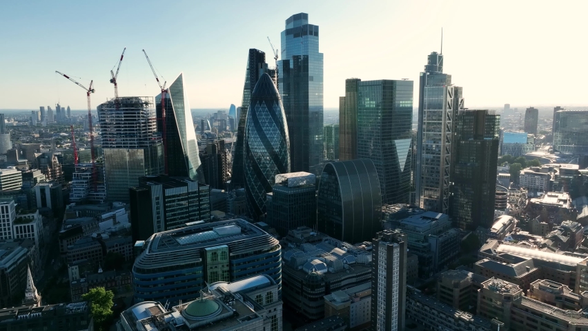 LONDON, UK - 10 JUNE 2022: Establishing Aerial drone View of Gherkin skyscraper with London Skyline, 20 Fenchurch or Walkie Talkie, sky garden by the Thames River, United Kingdom, Europe