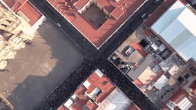 Drone video of the crowd in one of the main streets of Puebla city in Mexico, near the cathedral. International women's day march - Powered by Shutterstock - Get 15% off with code: PIKWIZARD15