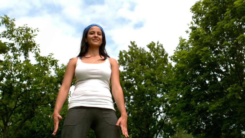 Animation of love text over biracial woman practicing yoga. Breast cancer awareness month and celebration concept digitally generated video.