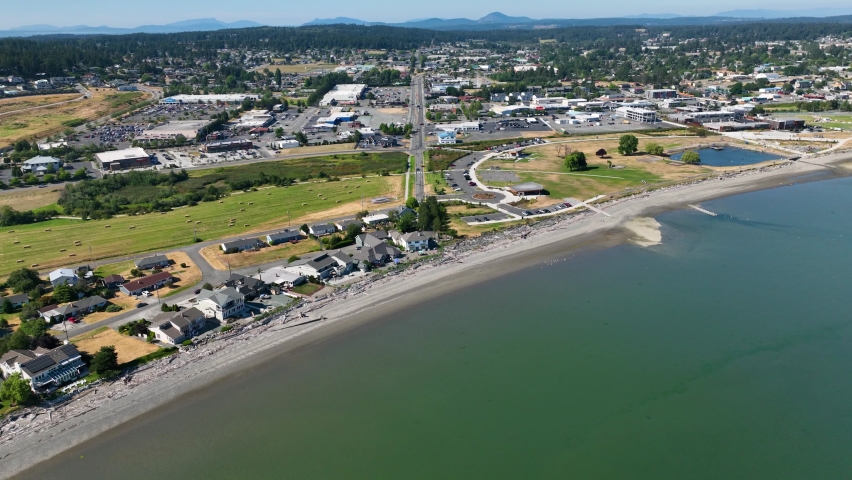 Aerial shot of Oak Harbor waterfront homes and Windjammer Park protected by the safety of the harbor.