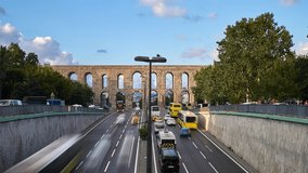 Sunset panorama time lapse clip with Valens Aqueduct (Bozdogan Su Kemeri) with traffic of cars, Istanbul, Turkey. It was a water-providing system of the Eastern Roman capital Constantinpole