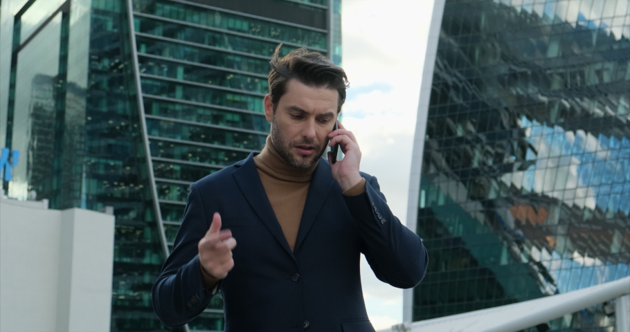 Businessman talking on the phone. caucasian man angry, frustrated and furious with his mobile phone, angry with customer service. Business man professional employee calling customer service support.