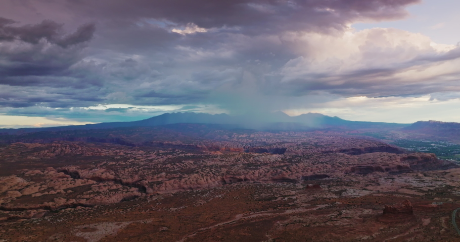 Fantastic scenic view of Zion national park in Utah, USA. Cumulus dramatic clouds accumulating over the rocks. Aerial view.