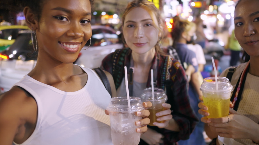 Groups of multi-ethnic female friends are enjoying a night out on Yaowarat Road or Chinatown in Bangkok, Thailand. Royalty-Free Stock Footage #1092975229