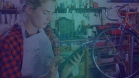 Animation of light trails over caucasian female mechanic using tablet. Global business, computing and digital interface concept digitally generated video. - Powered by Shutterstock - Get 15% off with code: PIKWIZARD15