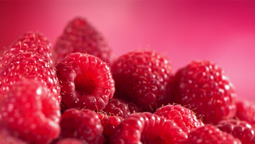 Ripe juicy Raspberry rolling above many Raspberries. 3D Illustration Royalty-Free Stock Footage #1092981717