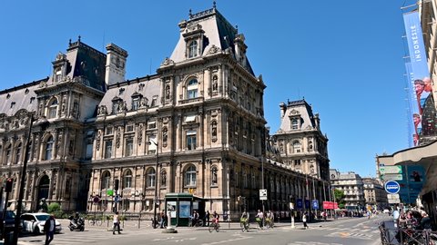 Paris, France, June 2022. Nice rear three-quarter footage of the City Hall, charming historic building along rue de rivoli. Pan movement, sunny day.