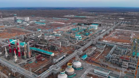 Large plant Oil refinery into plastic and other chemical compounds from oil and gas Aerial view of an oil refinery in Russia or Canada. Distillation columns for oil refining using Cracking
