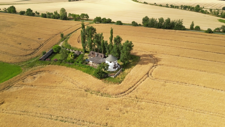 Fly around former windmill in the middle of wheat fields