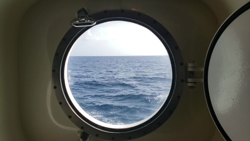footage of the Ocean view through the cruise ship porthole  Royalty-Free Stock Footage #1092996009
