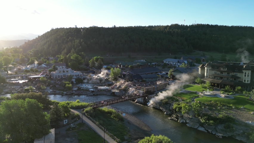 Pagosa Springs, Colorado at dawn with steam rising from hot springs. Aerial 4K cinematic drone footage.