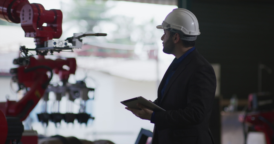 Business owner in formal suit walking inspecting.