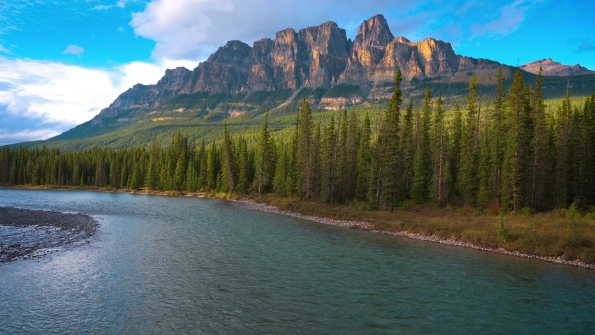 Castle Mountain and Bow River in Banff National Park at sunset. 4K UHD video.