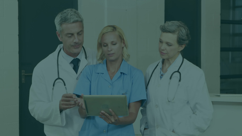 Animation of online security padlock over diverse doctors using tablet. Global medicine, healthcare, technology, online security and data processing concept digitally generated video. - Powered by Shutterstock - Get 15% off with code: PIKWIZARD15