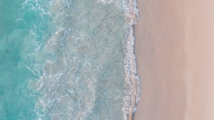 Phuket Thailand tropical beach Aerial drone top down view bird eye view of sea blue waves break on rock and sand. Beautiful of sea water wave come to beach. Royalty-Free Stock Footage #1093012067