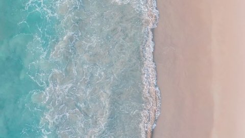 Phuket Thailand tropical beach Aerial drone top down view bird eye view of sea blue waves break on rock and sand. Beautiful of sea water wave come to beach.: film stockowy