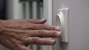 Light Switch On A Wall Is Turned Off By A Woman's Hand. Close Up Near Door. Woman Finger Pushing Light Switch Turn Off. 60 FPS, 4k, ProRes - Powered by Shutterstock - Get 15% off with code: PIKWIZARD15