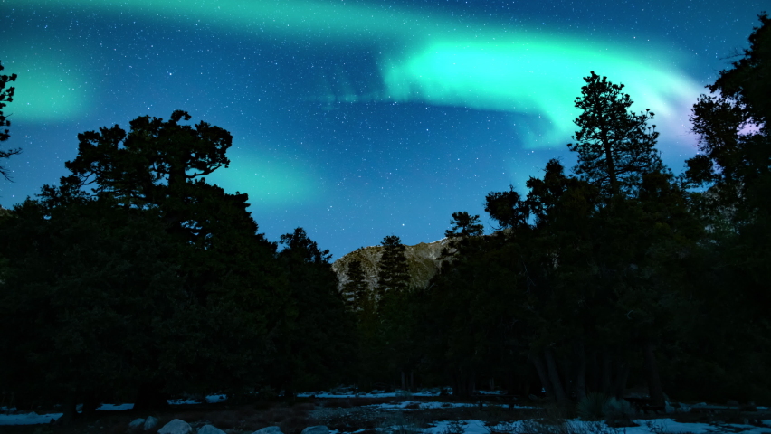 Aurora Borealis Green and Purple Loop Snow Mountain Northern Lights Royalty-Free Stock Footage #1093019569