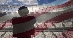Composite video of american flag over male rugby player against sports stadium. american sports tournament concept