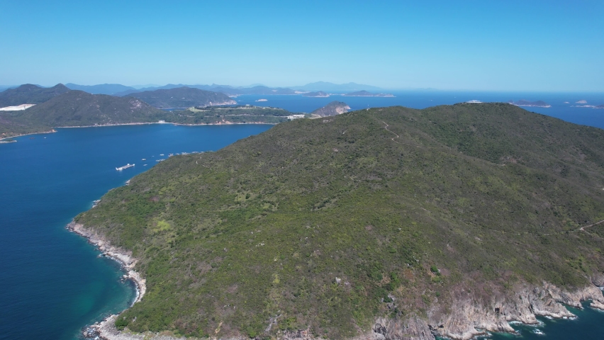 Tung Lung Chau, a coastal town of Hong Kong near Stanley and Shek O,is a fishing villages, beautiful scenery, hiking trails, beaches and islands, geological formations, sea bay, pier and boats in-shor | Shutterstock HD Video #1093034751