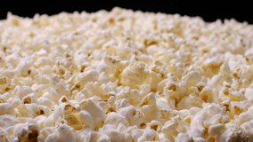Popcorn on the table. Closeup food video 4k