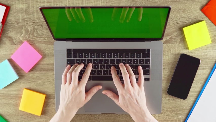 Man's hands is typing and studying with laptop green screen sitting at home. | Shutterstock HD Video #1093046043