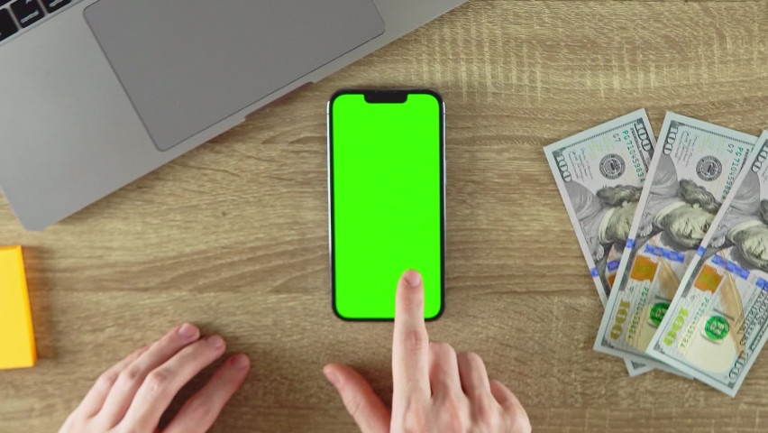 Scrolling the pages on the phone with green screen mockup. Vertical phone | Shutterstock HD Video #1093046061