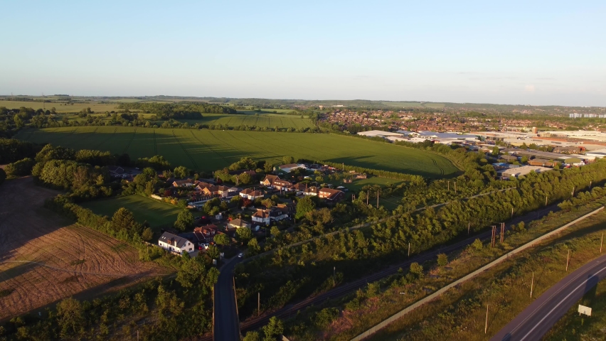 High Angle Footage of British Motorways at Sunset Time, The Location is M1 Junction 11a Interchange Close to Luton Town of England. Great Britain