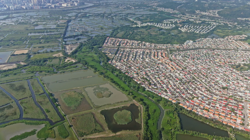 Elevated aerial view of Fairview Park near wetland in Yuen Long, Hong Kong | Shutterstock HD Video #1093071907