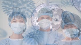 Animation of covid 19 cells over diverse surgeons in face masks. global covid 19 pandemic, medicine and healthcare services concept digitally generated video. - Powered by Shutterstock - Get 15% off with code: PIKWIZARD15