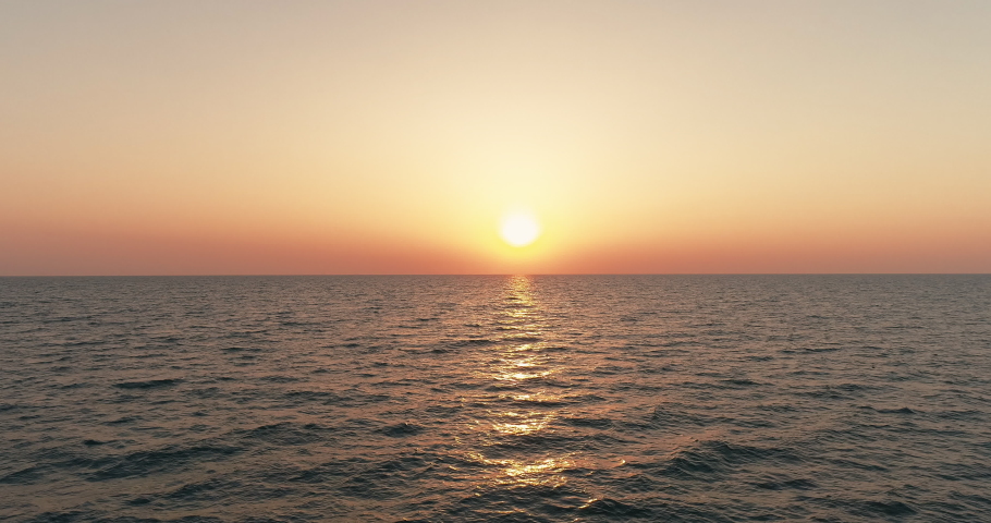 Sea scenery. Drone view. Sunset horizon. Nature beauty. Water landscape. Blue ocean waves relaxing motion on red orange sun light skyline background aerial shot. | Shutterstock HD Video #1093084239