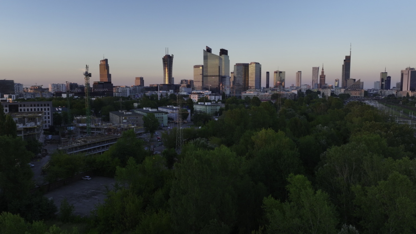 Aerial panorama of Warsaw city during sunset. View from Warsaw West train station side.