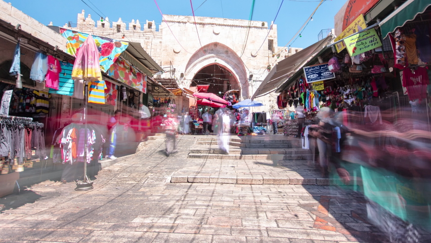 JERUSALEM, ISRAEL - CIRCA JUNE 2019: Back side of Damascus Gate or Shechem Gate timelapse hyperlapse, one of the gates to the Old City of Jerusalem, Israel. Crowd of people at old market