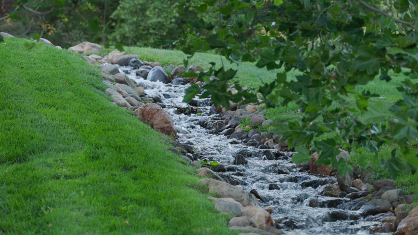 Reno Nevada Caughlin Ranch neighborhood walkway through public park with small stream from the Truckee River 
