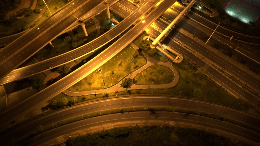 Aerial view from a drone flying over interchange and multi junction road. transportation concept. Night traffic time lapse. hyperlapse. Thailand
 | Shutterstock HD Video #1093089533