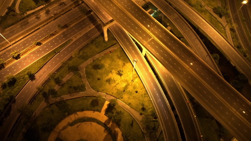 4K : Top view of interchange and multi junction road. The Intersection freeway road overpass the eastern outer ring road. Night traffic time lapse. Urban cityscape concept. hyperlapse
 | Shutterstock HD Video #1093089535