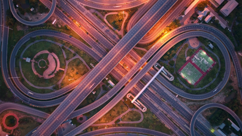 4K : Aerial view shot of fast moving above interchange and multi junction road. Night traffic time lapse. infrastructure in thailand. hyperlapse. traffic in Thailand
 | Shutterstock HD Video #1093089539