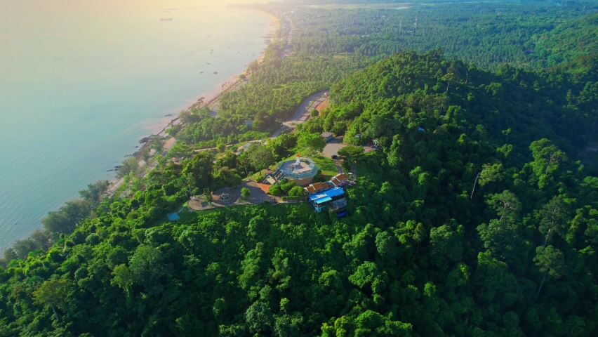 An aerial view from a drone flying over Mountain Matsee, a beautiful viewpoint in Chumphon Province. the coast in the background. 4k. drone
 | Shutterstock HD Video #1093089699