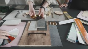 Creative studio solutions for interior design. Designers, men and women, choose combinations of surfaces and textures. - Powered by Shutterstock - Get 15% off with code: PIKWIZARD15