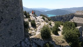 4k video made with a drone over the ruins of the castle of Samitier in the province of Huesca and municipality of Ainsa, in the Pyrenees of Aragon, where two mountaineers can be seen making the ascent