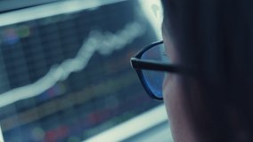 Close up shot of a woman using  tablet, with the reflection in the glasses - Powered by Shutterstock - Get 15% off with code: PIKWIZARD15