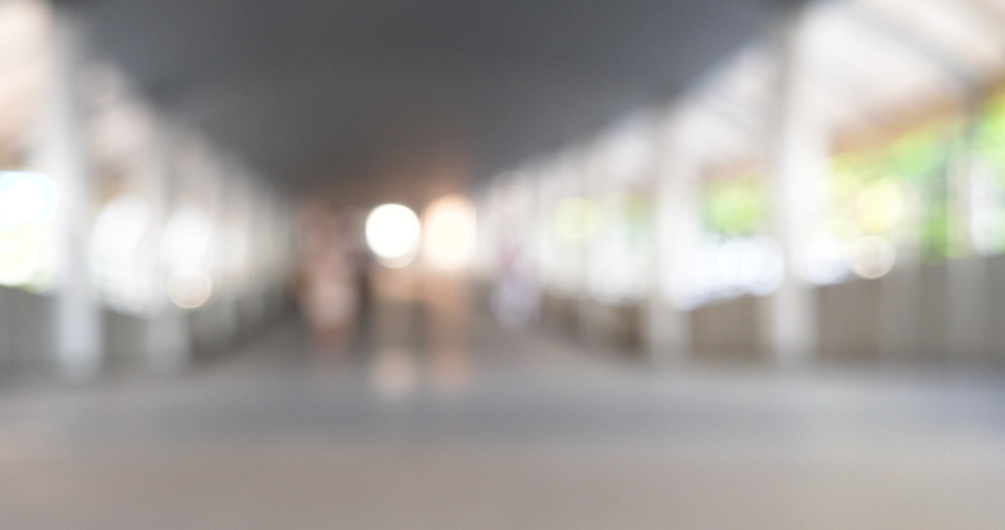 Blurred background shopping mall light bokeh business event in retail store. Blurry abstract background of store grocery. Blur Convention hall center audience present display goods products on shelf.