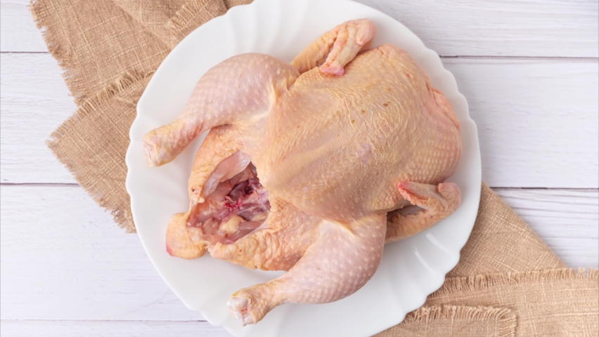Yummy stop motion animation of the preparation process with raw chicken becomes roasted, top view. Gourmet food concept. Royalty-Free Stock Footage #1093112397