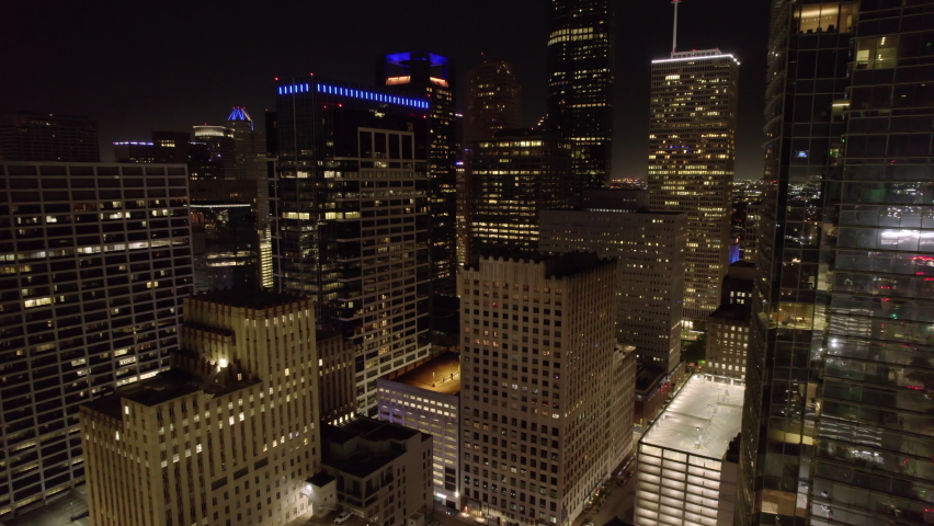 Aerial Backward Shot Of Illuminated Residential Buildings In City - Houston, Texas