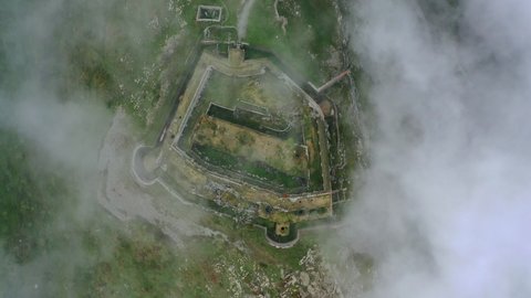 Aerial Top Panning Beautiful View Of Historic Fort On Hill, Drone Flying Over Clouds - Val-Cenis, France