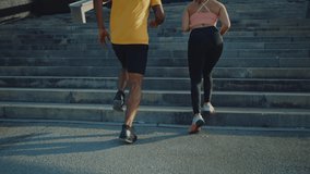 Cinematic video of urban runners athletes training outdoor in a modern part of the city. Concept about sport and healthy lifestyle