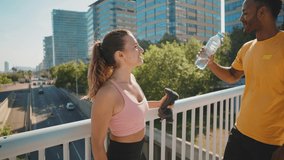 Cinematic video of urban runners athletes training outdoor in a modern part of the city. Concept about sport and healthy lifestyle