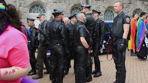 Fetishism - group of men wearing black, leather clothes on Victoria Square -  Birmingham Gay Pride, England 2015